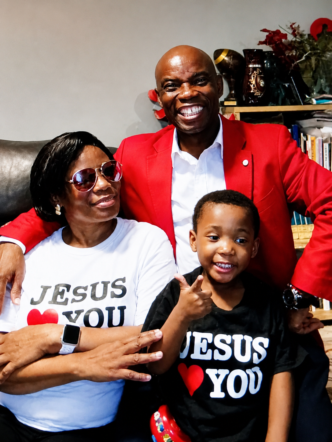 Pastor Elliott with family in Jesus Loves You shirts